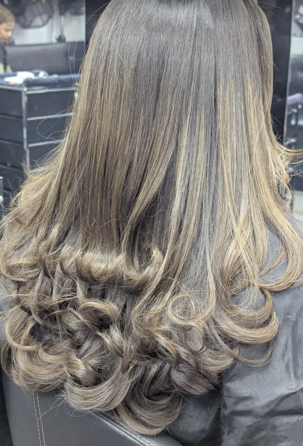 Brunette blowout with curled ends